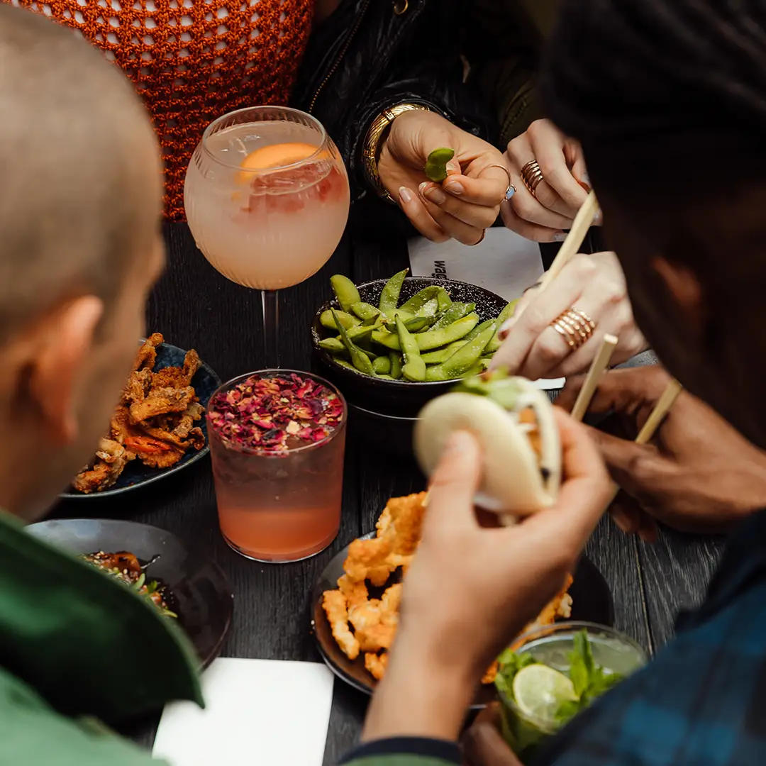 people eating from the vegan menu