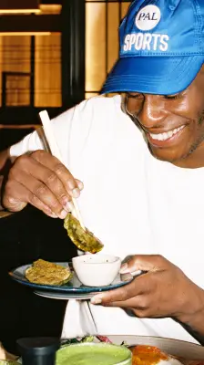 person eating vegetable gyozas